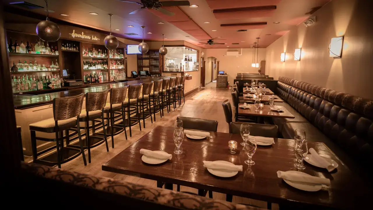 Modern commercial kitchen interior with stainless steel appliances and professional equipment